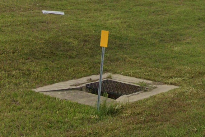 Yellow bollard marking drainage