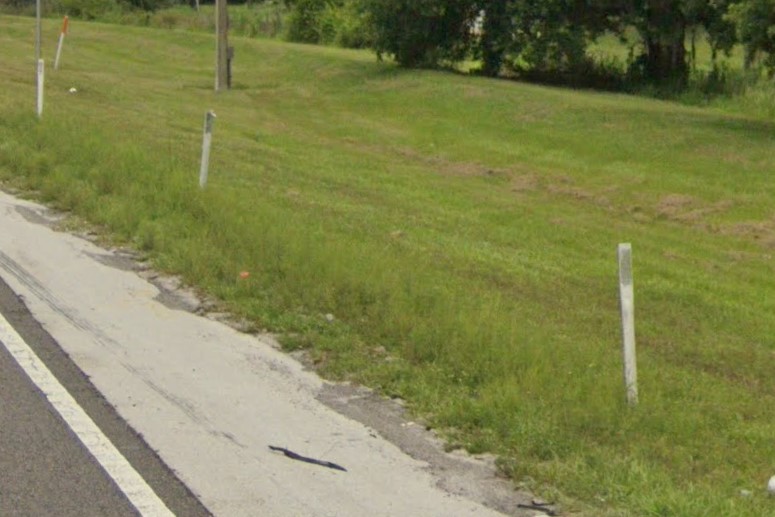 White bollards on offramps