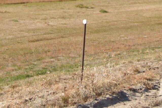 Bollard with white reflector