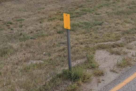 Flat yellow bollard