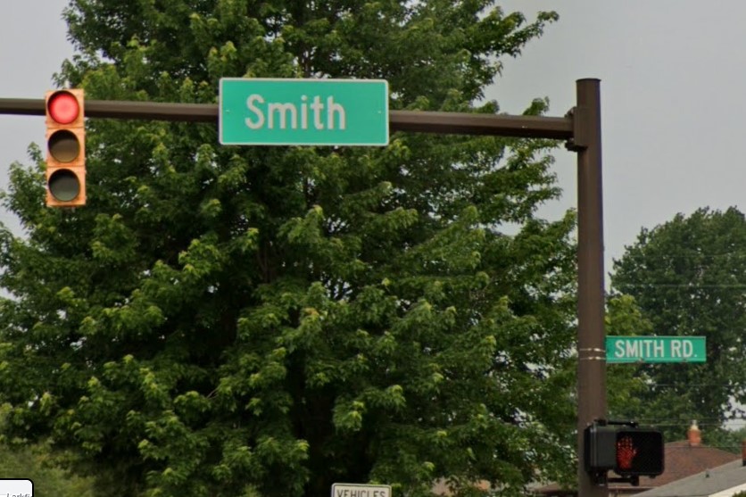 Sign over street and on pole