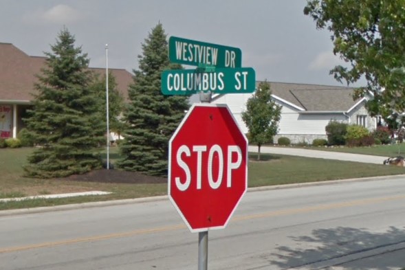 Street signs above stop sign