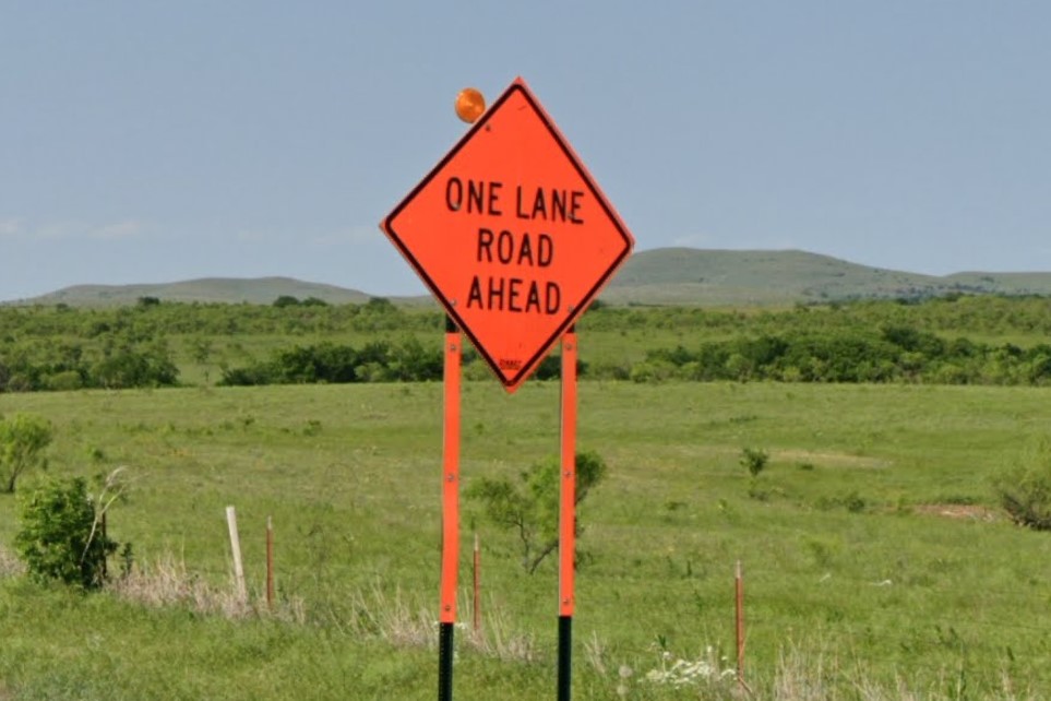 Orange legs on construction hazard sign