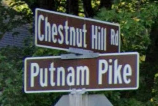 Brown street sign near Glocester